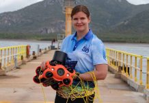 image: Melanie Olsen holding a Chasing M2 Pro drone, December 2022 | Australian Institute of Marine Science, Marie Roman