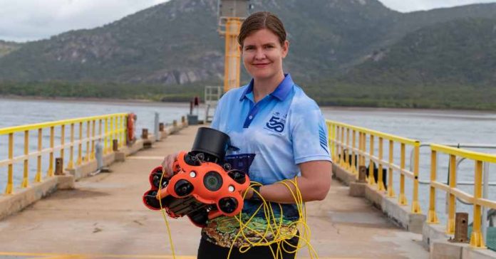 image: Melanie Olsen holding a Chasing M2 Pro drone, December 2022 | Australian Institute of Marine Science, Marie Roman